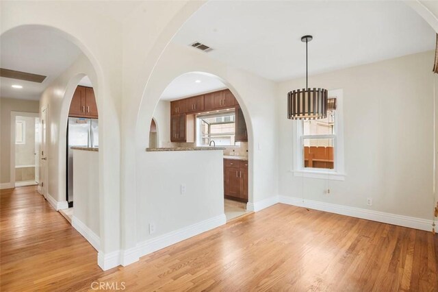 4718 Dawes St, San Diego, CA 92109 - unfurnished dining area with light wood finished floors and baseboards