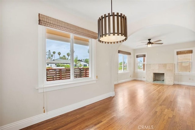 4718 Dawes St, San Diego, CA 92109 - unfurnished living room with baseboards, wood finished floors, ceiling fan, and a fireplace