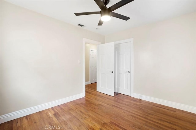 4718 Dawes St, San Diego, CA 92109 - unfurnished bedroom featuring baseboards, wood finished floors, ceiling fan, and a closet