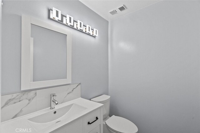 half bath with toilet and vanity