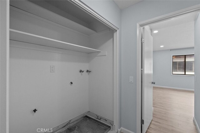 washroom featuring washer hookup, recessed lighting, baseboards, and wood finished floors