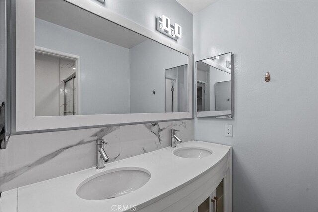 bathroom featuring double vanity