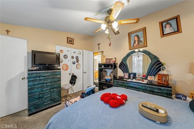 carpeted bedroom with a ceiling fan