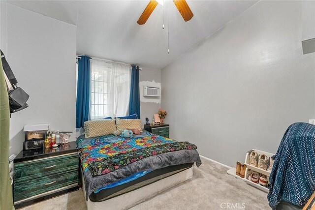 bedroom with an AC wall unit, a ceiling fan, and carpet flooring