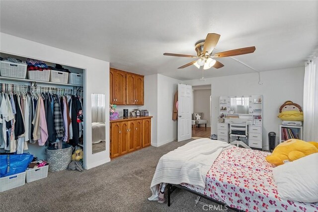 bedroom with a closet, carpet flooring, and a ceiling fan