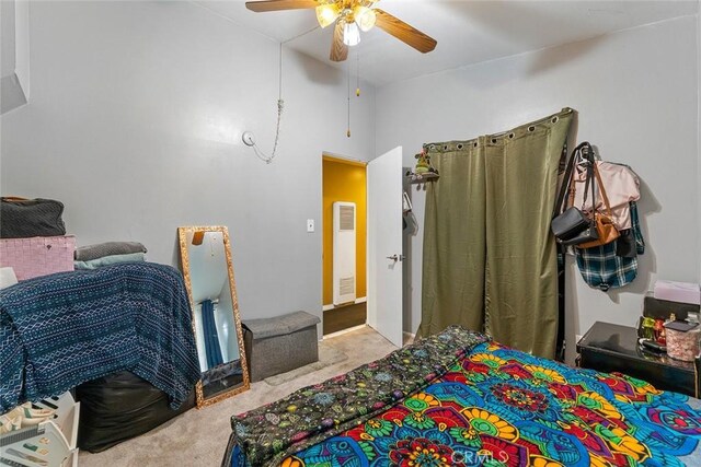 carpeted bedroom featuring a ceiling fan