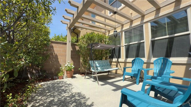 view of patio / terrace with fence and a pergola