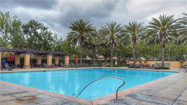 community pool featuring a patio area