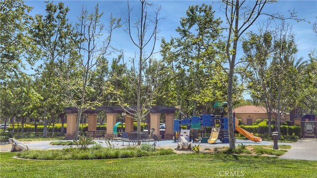 community jungle gym with a yard