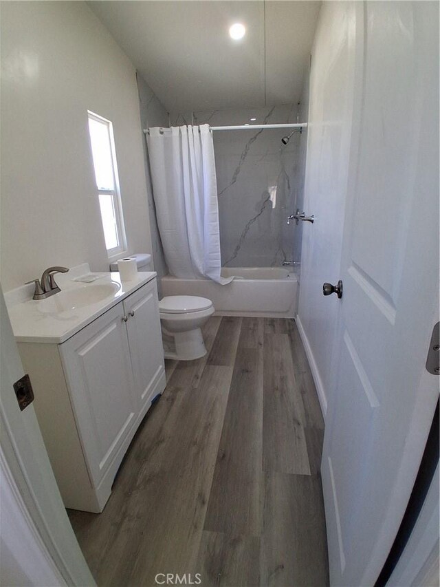 4626 Duncan Rd, Phelan, CA 92371 - full bath with vanity, shower / tub combo with curtain, toilet, and wood finished floors