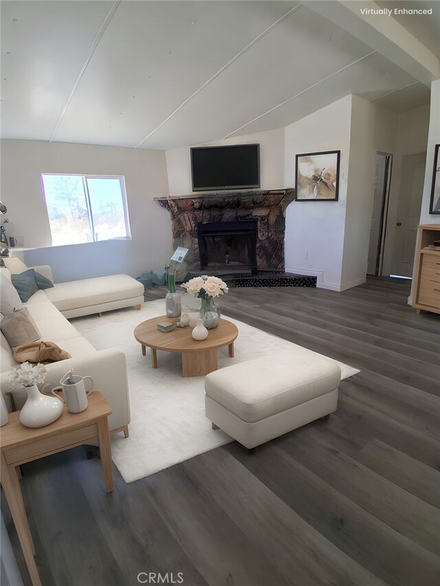 4626 Duncan Rd, Phelan, CA 92371 - living area with wood finished floors, a glass covered fireplace, and vaulted ceiling