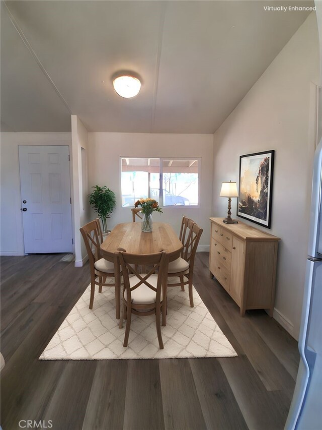 4626 Duncan Rd, Phelan, CA 92371 - dining space featuring dark wood-style flooring and vaulted ceiling