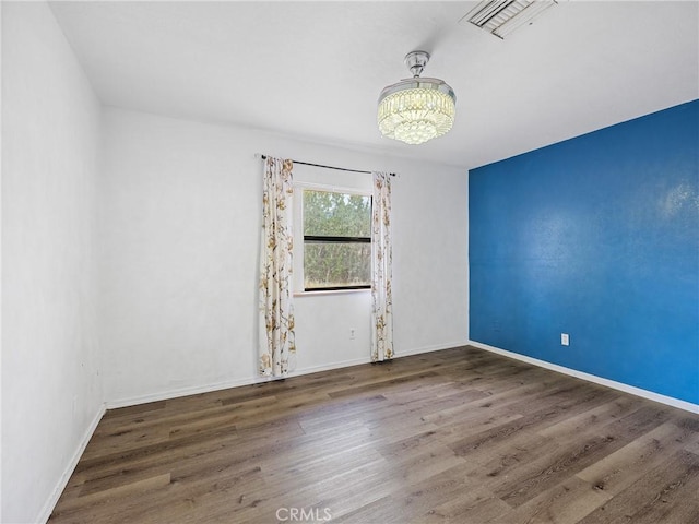 1275 Tamarack Rd, Pinon Hills, CA 92372 - empty room with a chandelier, wood finished floors, and baseboards