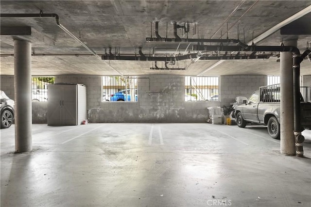 6255 Woodman Ave Unit 103, Van Nuys, CA 91401 - parking deck featuring concrete block wall