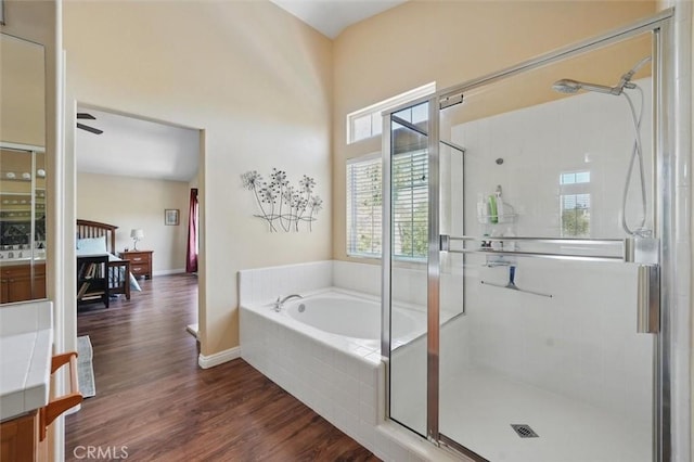 23405 Winslow Pl, Valencia, CA 91354 - full bath featuring a shower stall, a garden tub, and wood finished floors