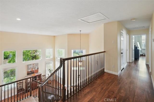 23405 Winslow Pl, Valencia, CA 91354 - hall with an upstairs landing, wood finished floors, healthy amount of natural light, baseboards, and recessed lighting