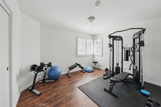 23405 Winslow Pl, Valencia, CA 91354 - exercise room featuring wood finished floors and baseboards
