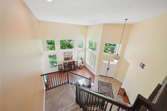 23405 Winslow Pl, Valencia, CA 91354 - stairs featuring carpet, baseboards, and a high ceiling