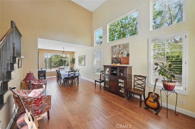 23405 Winslow Pl, Valencia, CA 91354 - living area with hardwood / wood-style floors, baseboards, and a towering ceiling