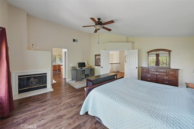 23405 Winslow Pl, Valencia, CA 91354 - bedroom with wood finished floors, a glass covered fireplace, high vaulted ceiling, baseboards, and ceiling fan