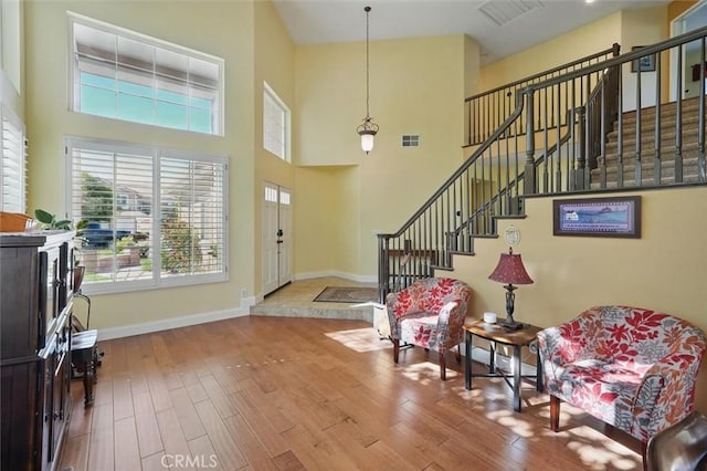 23405 Winslow Pl, Valencia, CA 91354 - foyer entrance with plenty of natural light, baseboards, wood finished floors, and a high ceiling