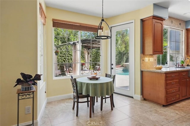 23405 Winslow Pl, Valencia, CA 91354 - dining space with baseboards and light tile patterned flooring