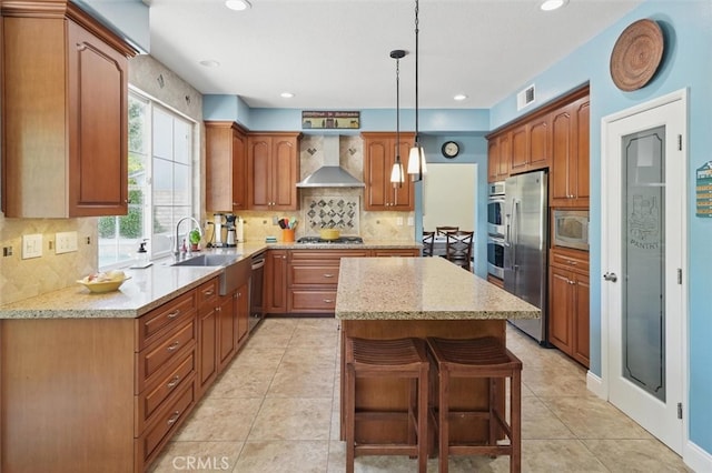23405 Winslow Pl, Valencia, CA 91354 - kitchen with wall chimney range hood, stainless steel appliances, a sink, a center island, and tasteful backsplash