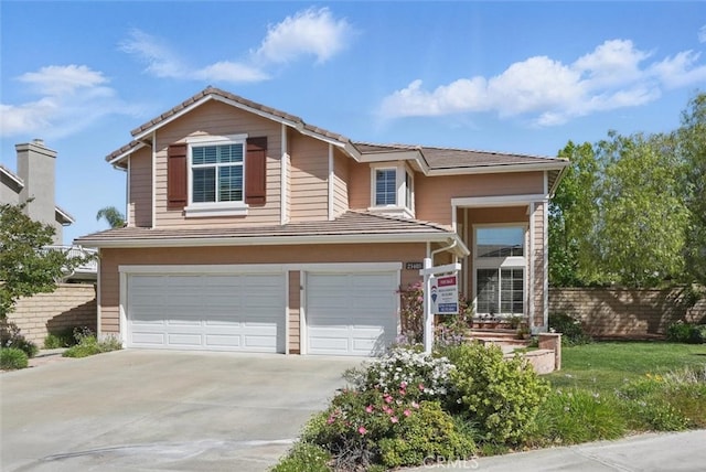 23405 Winslow Pl, Valencia, CA 91354 - view of front facade with an attached garage, concrete driveway, fence, and a tiled roof