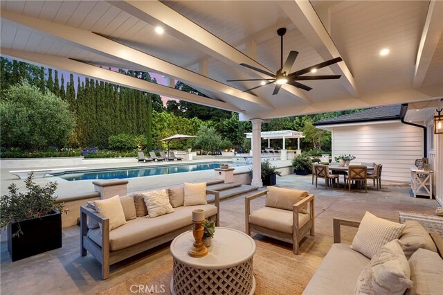 view of patio / terrace featuring an outdoor hangout area, outdoor dining area, a ceiling fan, and an outdoor pool