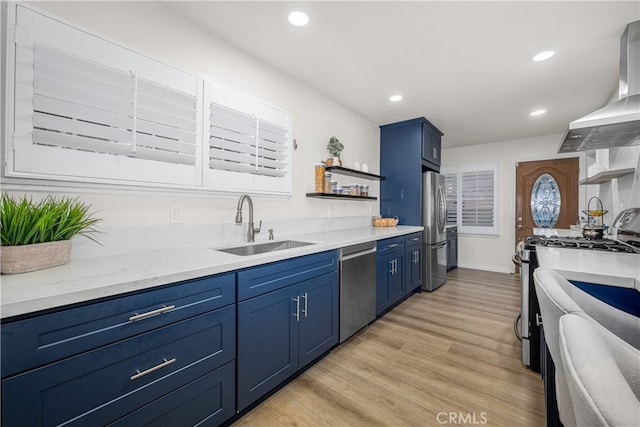 kitchen featuring open shelves, stainless steel appliances, blue cabinetry, a sink, and recessed lighting