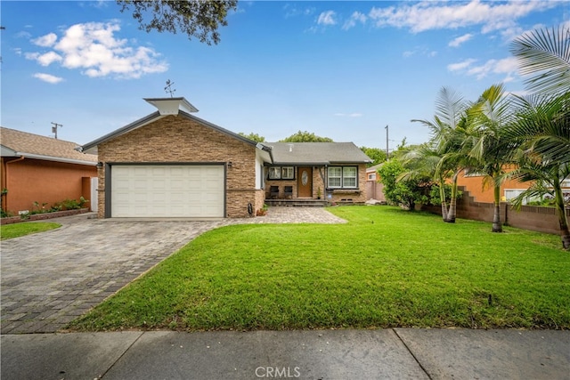 single story home featuring a garage and decorative driveway