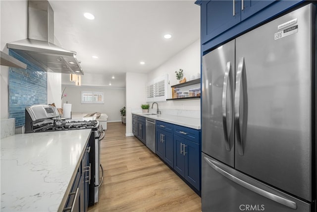 kitchen with stainless steel appliances, ventilation hood, blue cabinets, open shelves, and a sink