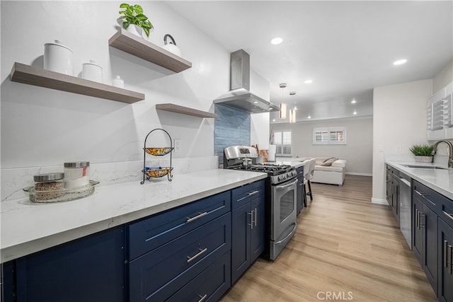 kitchen with open shelves, appliances with stainless steel finishes, island range hood, a sink, and blue cabinets