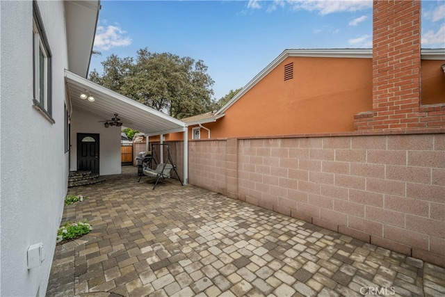 view of patio with fence