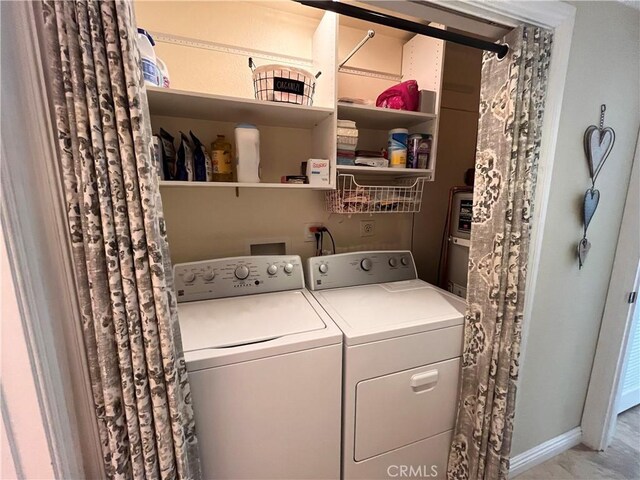 laundry area with independent washer and dryer