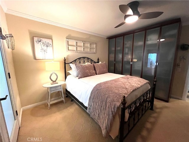3747 Vista Campana S Unit 7, Oceanside, CA 92057 - bedroom featuring crown molding, light carpet, baseboards, and a ceiling fan