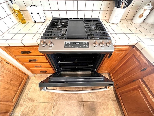 3747 Vista Campana S Unit 7, Oceanside, CA 92057 - kitchen view of stainless steel range with gas cooktop and tasteful backsplash