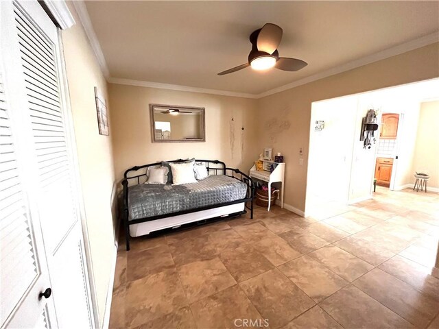 3747 Vista Campana S Unit 7, Oceanside, CA 92057 - bedroom featuring crown molding, baseboards, and a ceiling fan