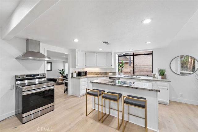 24572 Wembley Cir, Laguna Hills, CA 92653 - kitchen featuring electric range, wall chimney range hood, a sink, light wood-style flooring, and recessed lighting