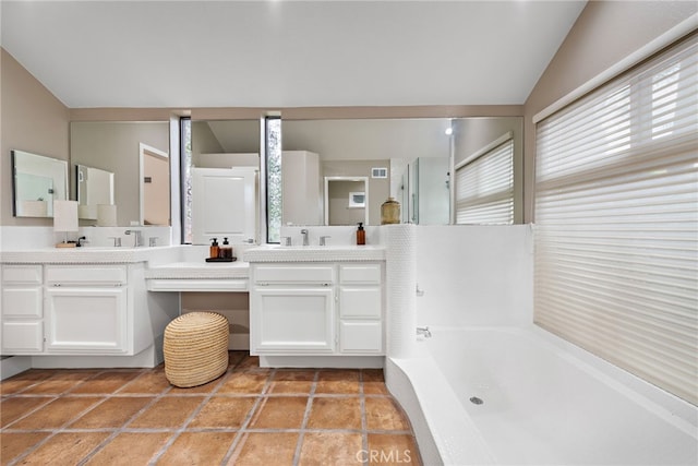 24572 Wembley Cir, Laguna Hills, CA 92653 - full bathroom with a bath, double vanity, and lofted ceiling