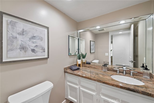 24572 Wembley Cir, Laguna Hills, CA 92653 - bathroom featuring toilet and vanity