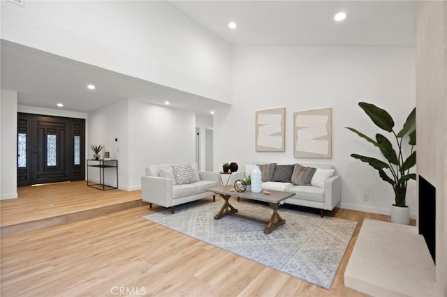 4592 Paloma Ln, Yorba Linda, CA 92886 - living area with recessed lighting, wood finished floors, baseboards, and a towering ceiling