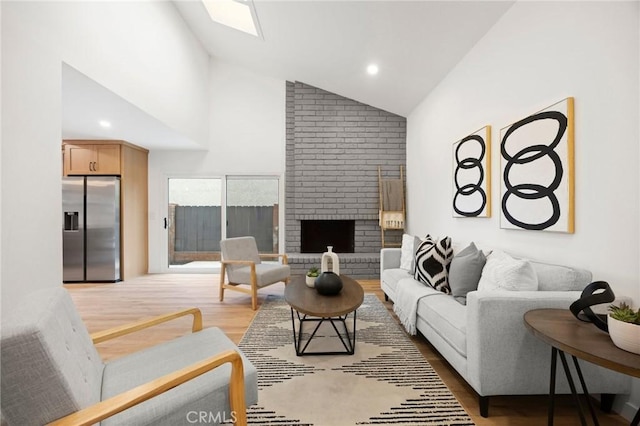 4592 Paloma Ln, Yorba Linda, CA 92886 - living area featuring light wood-type flooring, a fireplace, high vaulted ceiling, and recessed lighting