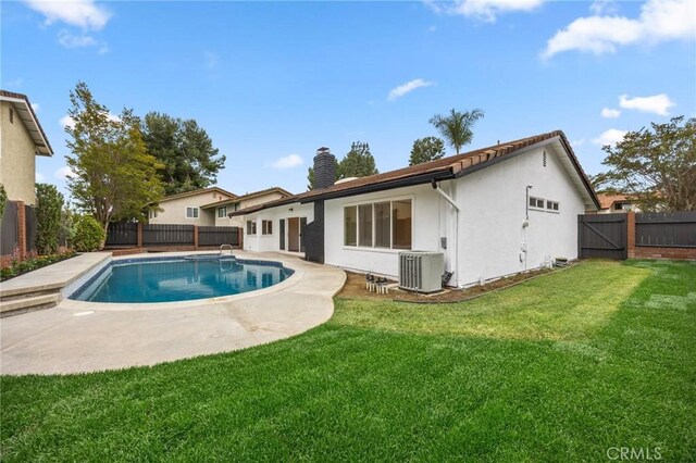 4592 Paloma Ln, Yorba Linda, CA 92886 - rear view of property with a chimney, a patio, cooling unit, and stucco siding
