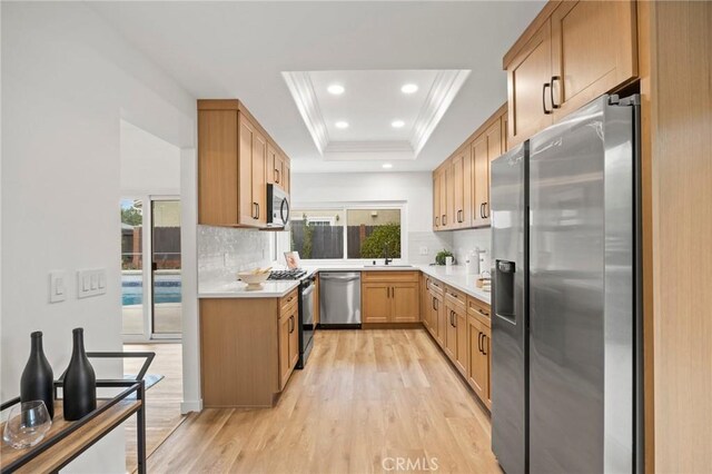 4592 Paloma Ln, Yorba Linda, CA 92886 - kitchen with stainless steel appliances, a sink, light wood-style flooring, backsplash, and recessed lighting