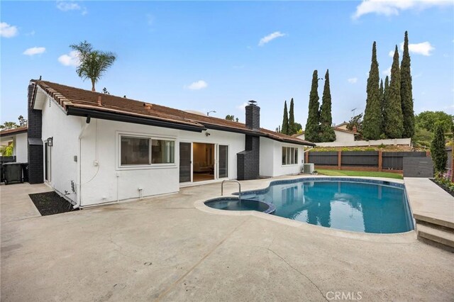 4592 Paloma Ln, Yorba Linda, CA 92886 - view of pool with a patio, a fenced backyard, a pool with connected hot tub, and central air condition unit
