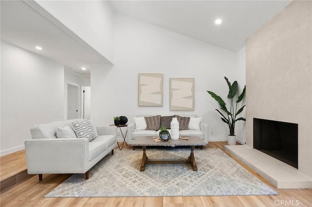 4592 Paloma Ln, Yorba Linda, CA 92886 - living area with wood finished floors, baseboards, high vaulted ceiling, and recessed lighting