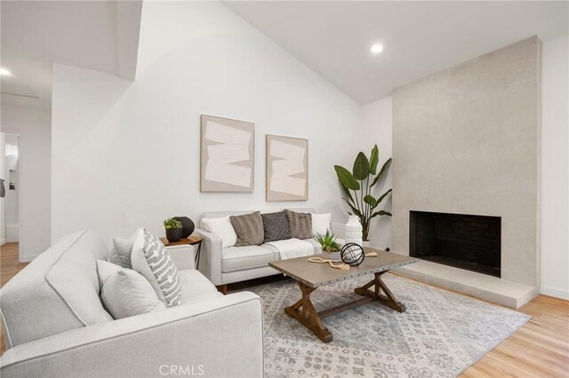 4592 Paloma Ln, Yorba Linda, CA 92886 - living room with wood finished floors, recessed lighting, high vaulted ceiling, baseboards, and a fireplace