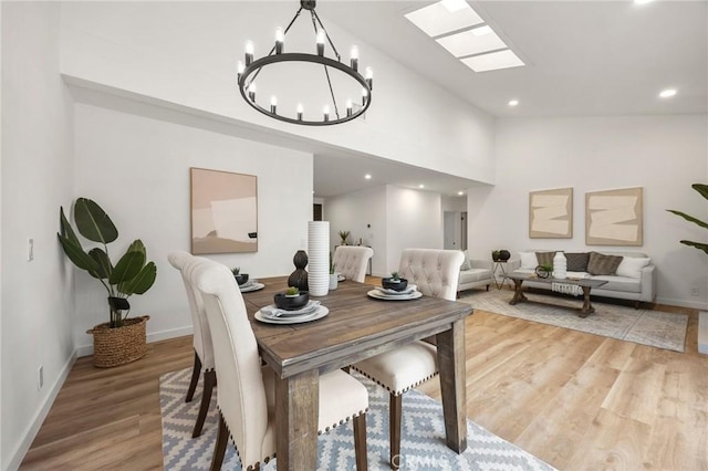 4592 Paloma Ln, Yorba Linda, CA 92886 - dining room featuring a chandelier, vaulted ceiling, light wood finished floors, baseboards, and recessed lighting