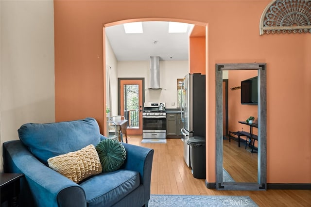 12760 Center Gap Rd, Chico, CA 95928 - living room featuring arched walkways and light wood-style floors